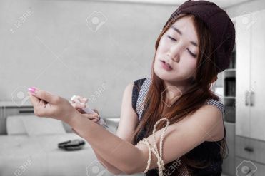 Drug addict teenage girl with syringe